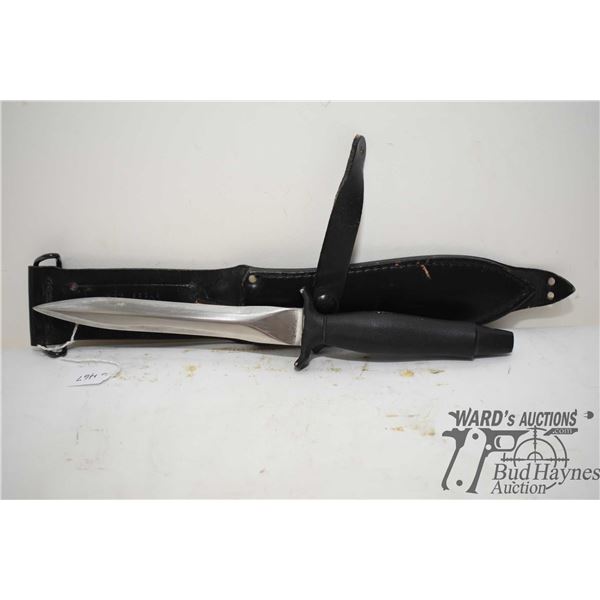 Gerber combat dual edge knife w/ a 6 3/4" blade (11 3/4" overall) and original sheath/ Serial # 0979