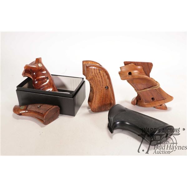 Five sets of assorted handgun grips including Smith and Wesson