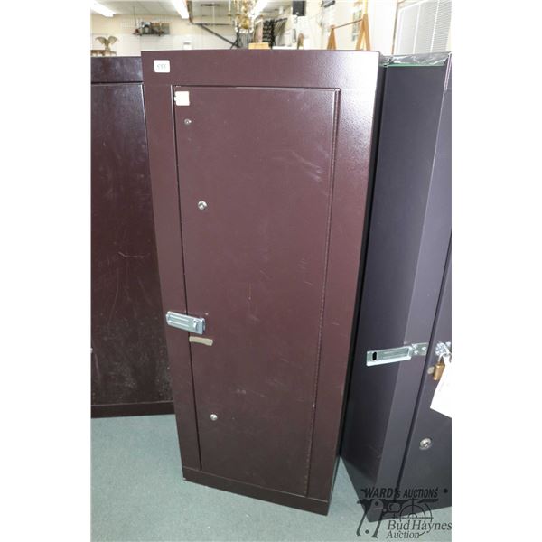 Metal gun locker with spaces for eight long guns, measures 55" H X 21" W X 10" D, locked and has no 