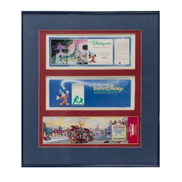 A Pair of Framed Disney Park Commemorative Passports.