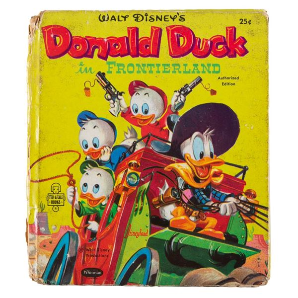 A "Donald Duck in Frontierland" Hardcover Book.