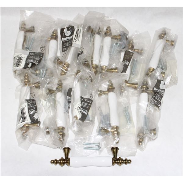 BAG OF BRASS AND WHITE CABINET PULLS