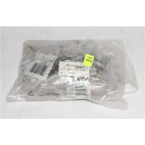 TRAY OF BRASS AND WOOD FINISH CABINET PULLS