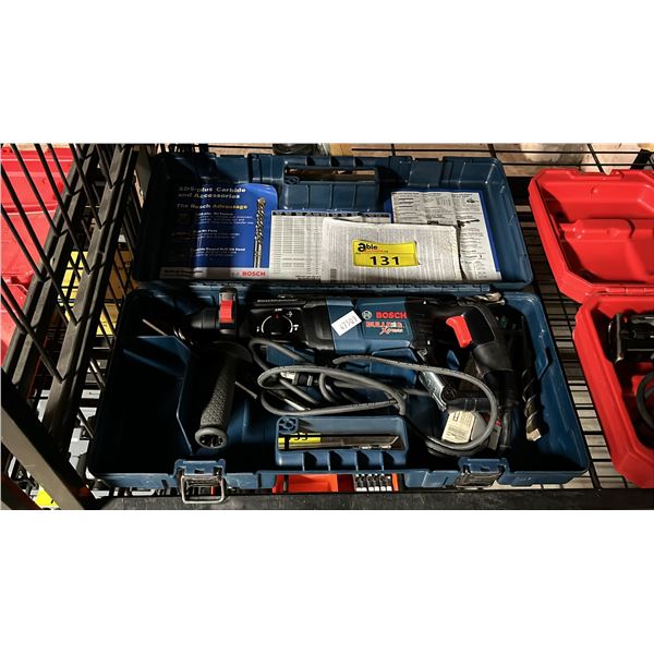 BOSCH BULLDOG XTREME VARIABLE SPEED ELECTRIC ROTARY HAMMER IN A HARD TRANSPORT CASE