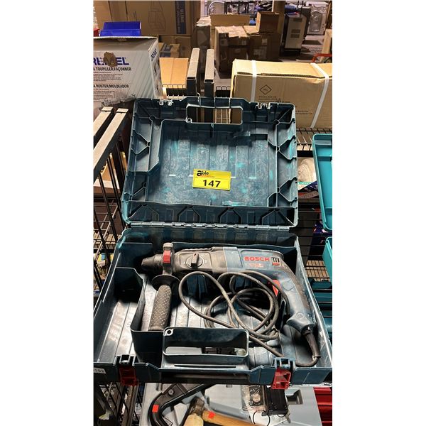 BOSCH BULLDOG XTREME VARIABLE SPEED ELECTRIC ROTARY HAMMER IN A HARD TRANSPORT CASE