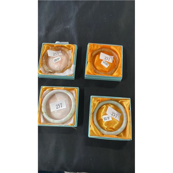 4 ASSORTED JADE BANGLE BRACELETS