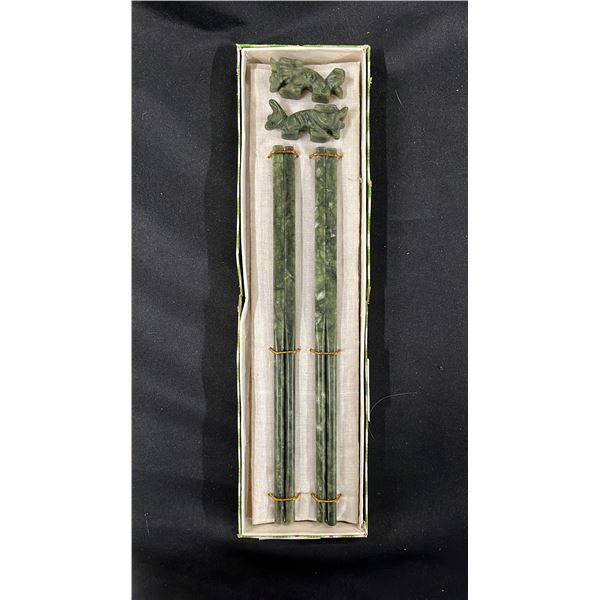 PAIR OF JADE CHOPSTICKS WITH CARVED JADE CHOPSTICK RESTS