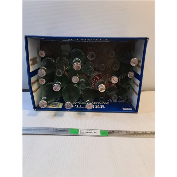 Various Empty Coca-Cola Bottles
