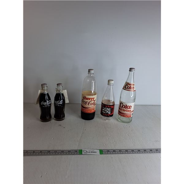 Glass & Plastic Coca Cola Bottles Up To 1ft ( some filled with pop)- cannot Ship