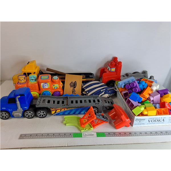 Box Of Assorted Plastic Toys - Trucks, Blocks , Baseball Mitt, Vtech Train Powers On