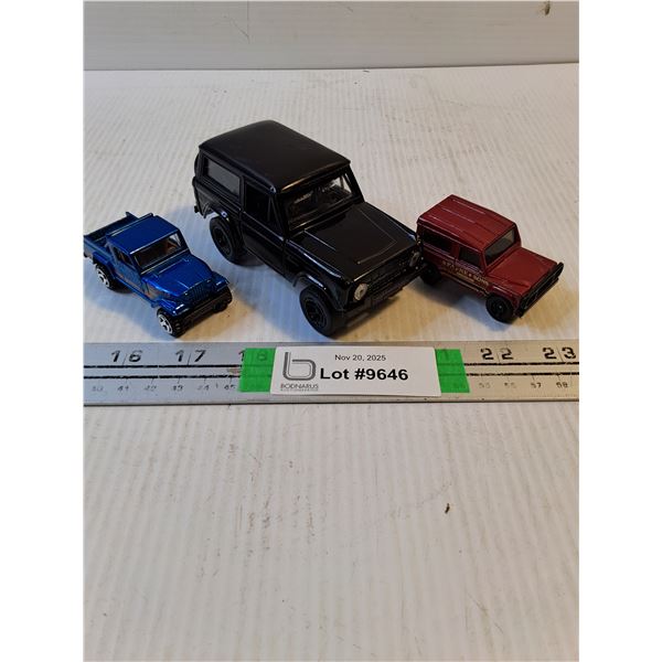 Black Ford Bronco,Blue Jeep and Land rover