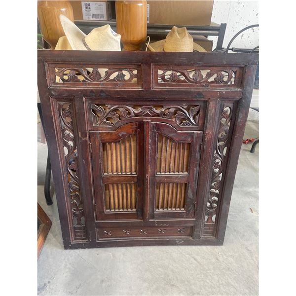 Wooden Panel With Hinged Shutter Doors and Ornamental Carving