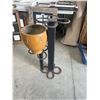 Image 1 : Metal Plant Stand With Ceramic Pot and Circular Design Elements