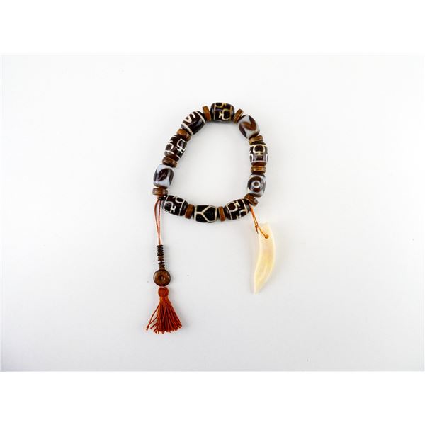 SINO-TIBETAN OFFICER'S DZI BEAD AND BONE PRAYER BRACELET