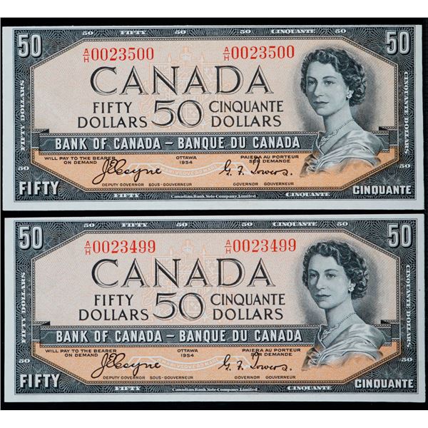 1954 $20 BC-34a #A/H0023499-23500  Lot of 2 consecutive Devil's Face notes in AU or better.