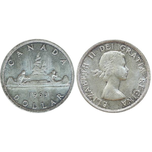 1963 $1 ICCS Gem Mint State-65, Delicate toning over full underlying lustre.