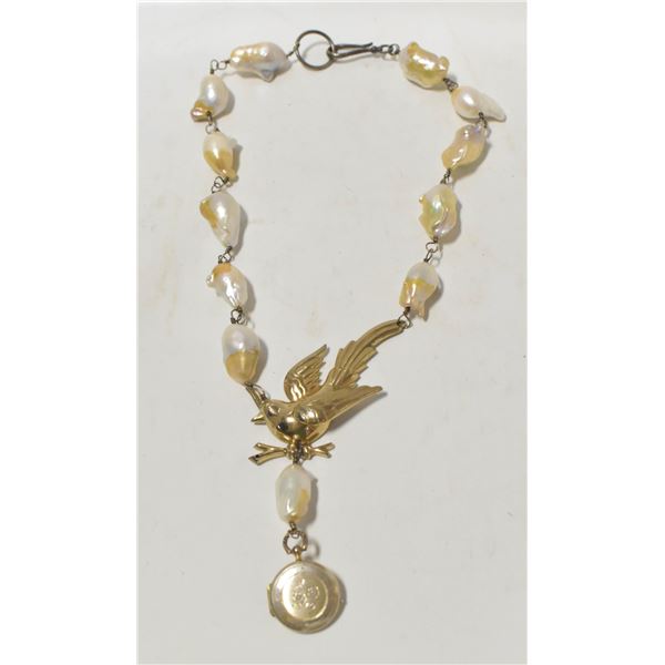 ANTIQUE BEADED NECKLACE WITH STERLING SILVER BIRD