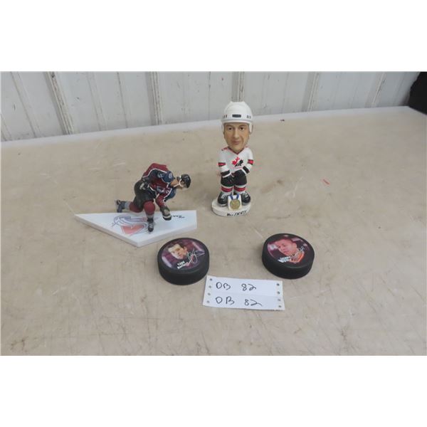 Sakic/MacInnis Figurines and 2 Hockey Pucks