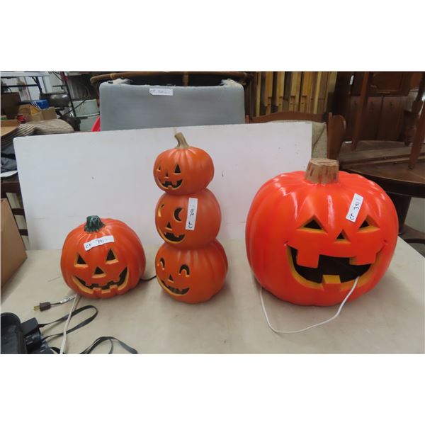 Three Light-Up Pumpkin Display Decorations