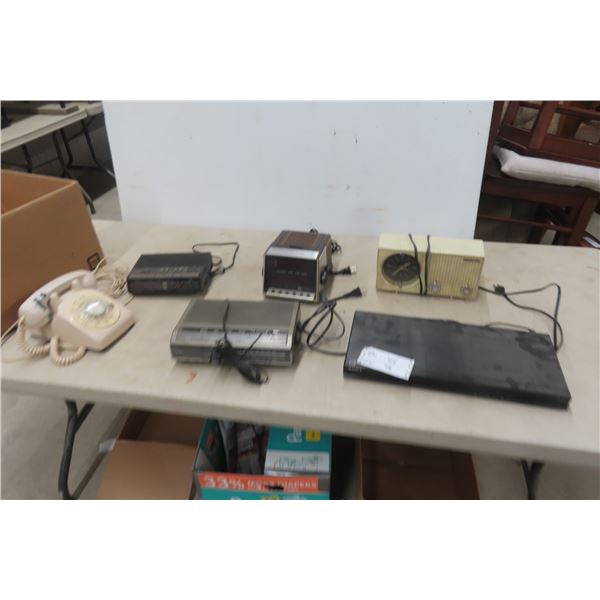 Assorted Electronics: Lloyds Alarm Clock, Candle Chrome Clock, Sony DVD Player, and Telephone