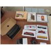 Image 1 : HO Scale Model Train Set with 4 Cars, Engine, Tracks, Buildings, Transformer, and More