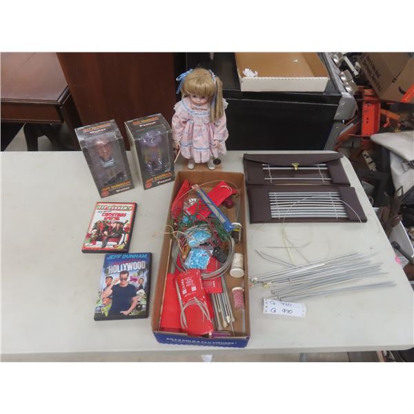 Knitting Needles; Porcelain Doll; Two DVDs; and Two Talking Head Knockers.