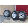 Image 1 : Three Trailer Tires and Rims ST205/75-15: Two Decent (~50% Tread) and One Poor