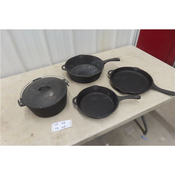 Three Cast-Iron Frying Pans and Cast-Iron Dutch Oven