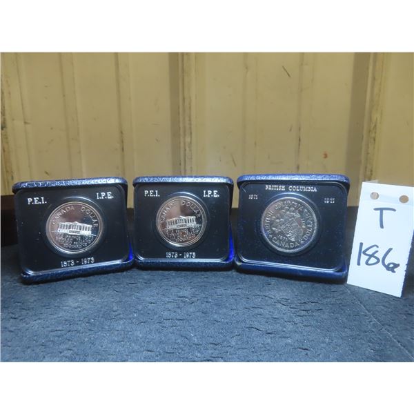 Three Canadian 1973 PEI and BC Centennial Uncirculated Dollar Coins