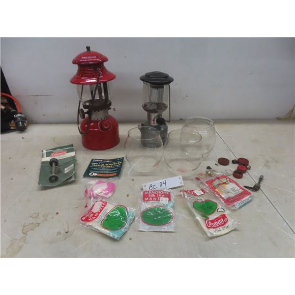 Two Coleman Lanterns (Models 200 and 226) with Extra Globes and Parts
