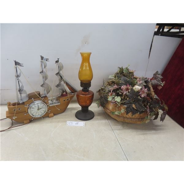 Ship Clock, Flower Arrangement, and Oil Lamp