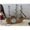 Image 2 : Ship Clock, Flower Arrangement, and Oil Lamp