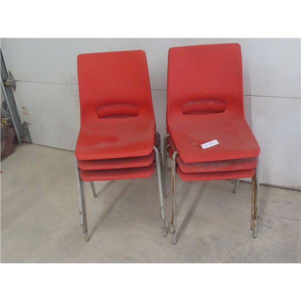 Six Orange Plastic Stacking Chairs