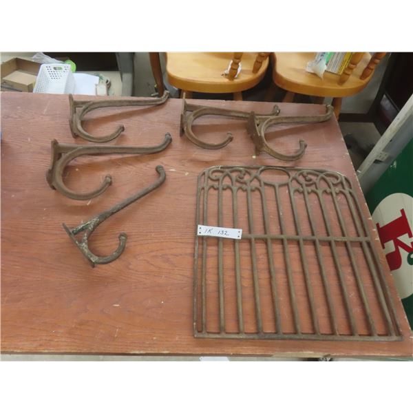 Five Cast-Iron Hooks and Cast Grate (19" × 17")