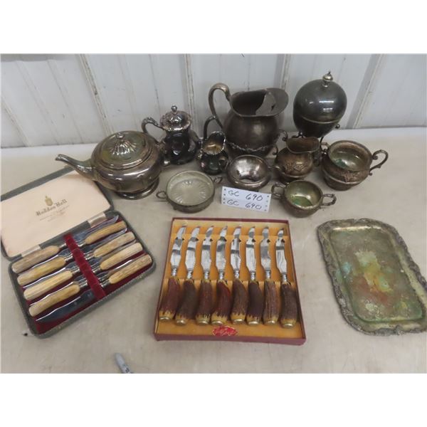 Eleven Pieces of Silverware and Two Carving Knives