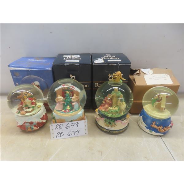 Four Christmas Snow Globes