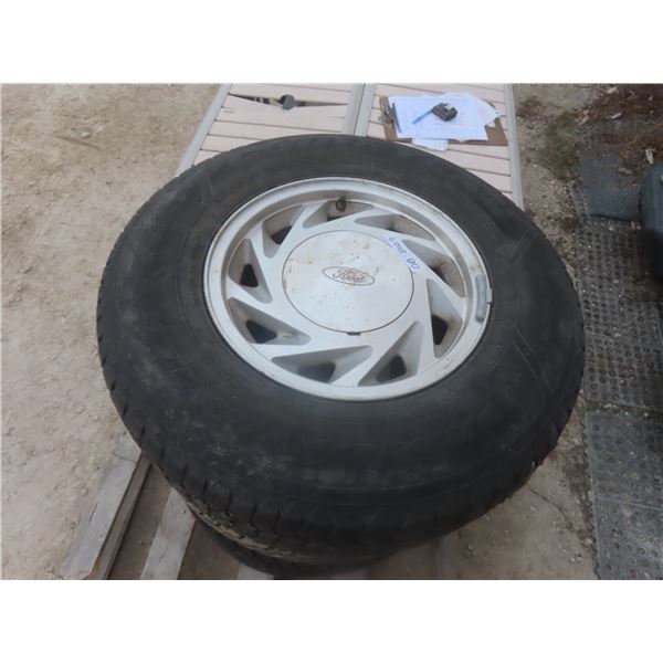 Four Ford Rims with Goodyear 235/75R15 Tires