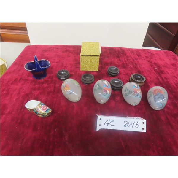 Four Chinese Reverse-Painted Glass Egg Ornaments with Stands