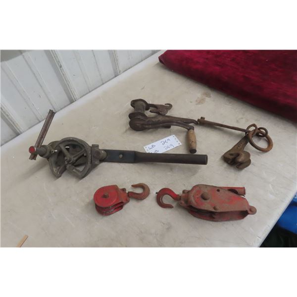 Five Antique Pulleys and a Fence Stretcher