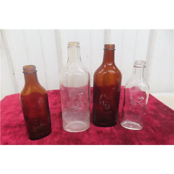 Four Vintage Scott’s Emulsion Embossed Cod Liver Oil Bottles (Clear and Amber)