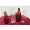 Image 1 : Four Vintage Scott’s Emulsion Embossed Cod Liver Oil Bottles (Clear and Amber)