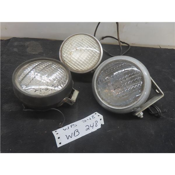 Two Vintage Ford 8N Tractor Lights and One John Deere Tractor Light