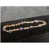 Image 1 : 10k Gold Bracelet with Nine Amethyst Gems, 4 Grams, 7.5" Length, Missing Clasp Lock