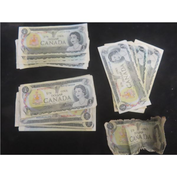 Twenty-Seven 1973 Canadian $1 Bills Plus One Torn Bill