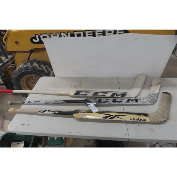 Three Goalie Hockey Sticks