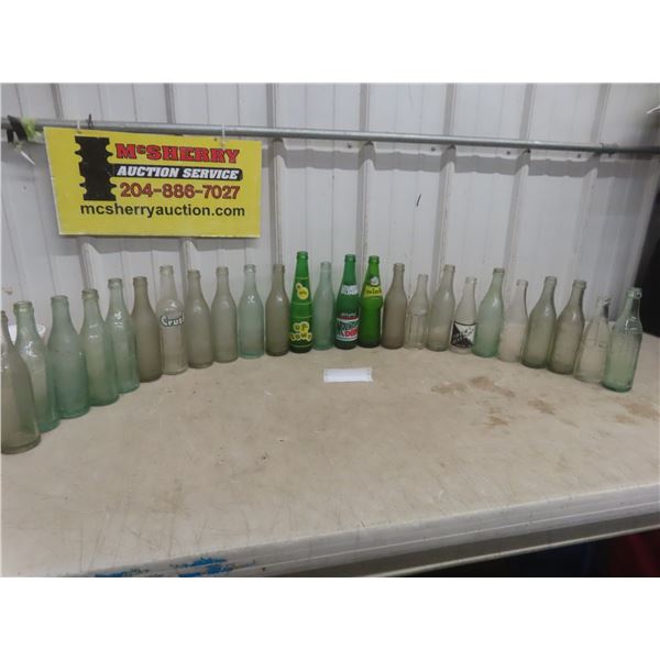 Twenty-Five Soda Bottles Including Wink, Uptown, Pachal’s, Mountain Dew, and More