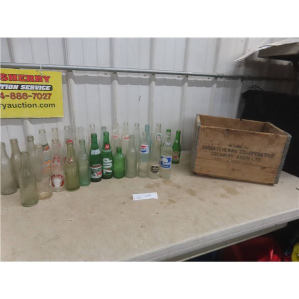 Twenty-Eight Soda Bottles Including Galgary, Double Cola, Pepsi, 7Up, and Wood Crate