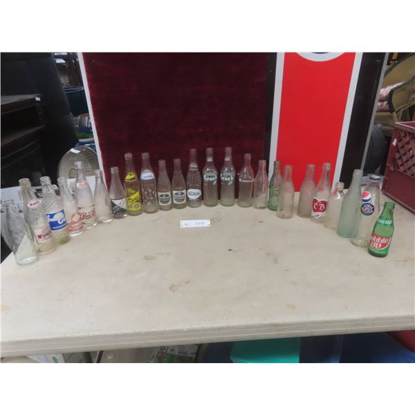Twenty-Four Soda Bottles Including Mission, Snow White, Stubby, Wynola, and Beer Bottling