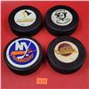 4 NHL Team Hockey Pucks w/ Mighty Ducks, Canucks, Penguins, & Islanders