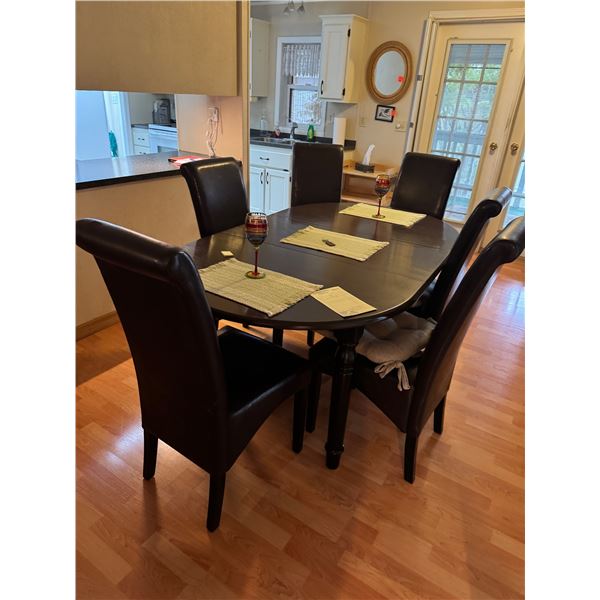 Dining table and chairs has one leaf in it in picture table is 53 inches leaf is 18 inches some chai